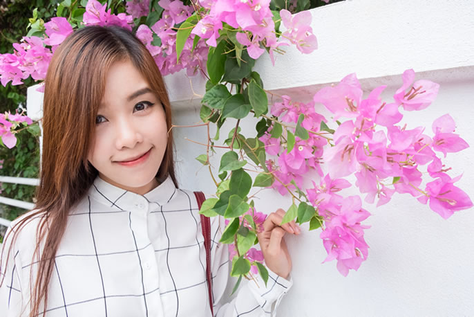 Student with pink flowers and long hair